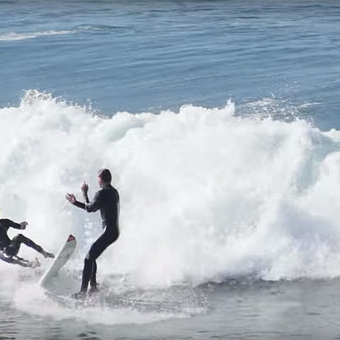 The drop-in offender takes it up a notch and, in what is a total dick move, actually tries to shove the guy he dropped in on off his board.