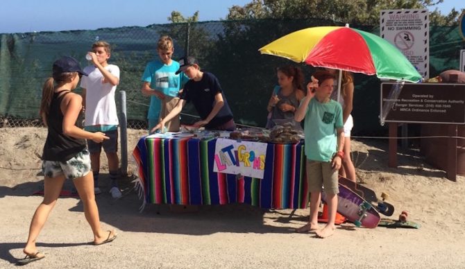 The Latigroms hawking their wares. All for a good cause.