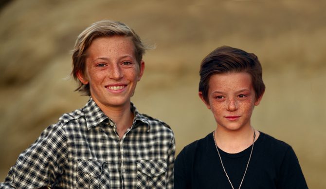 Diego, 13 (L) and Niko, 11 (R), along with their buddies, are just happy they can do some good, and surf uncrowded Malibu once a year with some of their heroes.
