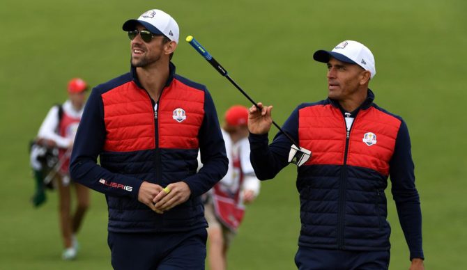 Sep 27, 2016; Chaska, MN, USA; US swimmer Michael Phelps and Pro surfer Kelly Slater on the first green in the celebrity tournament during a practice for the 41st Ryder Cup at Hazeltine National Golf Club. Mandatory Credit: Michael Madrid-USA TODAY Sports