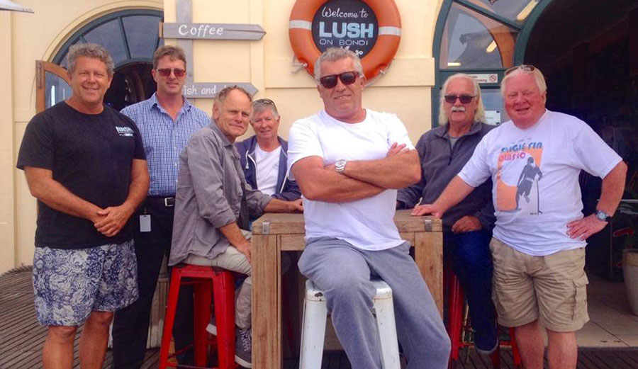 Brad Farmer and John Sullivan flank some of the interim Bondi Beach National Surfing Reserve working committee. Photo: Bondi Lush
