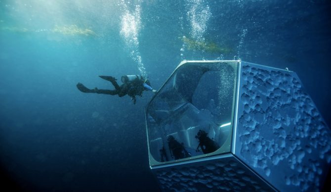 Divers swim up to Doug Aitken's art installation, made up of three pavilions, off the coast of Catalina. Photo: Patrick T. Fallon/NY Times