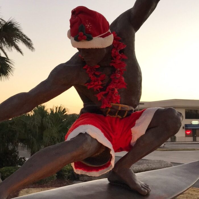Kelly Slater statue in Cocoa Beach dressed up for the holidays