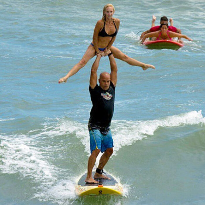 Ed Martinez and his wife tandem surfing and political champs. Photo: @tandemsurfing
