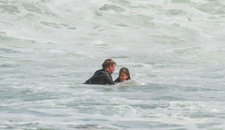 Taj, mid-rescue. Photo: Surfing WA/Nick Woolacott