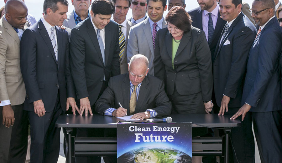 California Gov. Jerry Brown signs SB350 on Oct. 7, 2015. The bill calls for increasing the state’s renewable electricity use to 50 percent and doubling energy efficiency in existing buildings by 2030. AP Photo/Damian Dovarganes