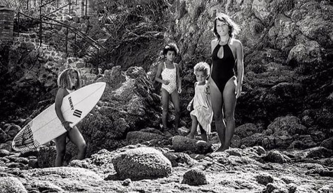 A single mom. Three kids. Forever chasing dreams, and now chasing waves too.