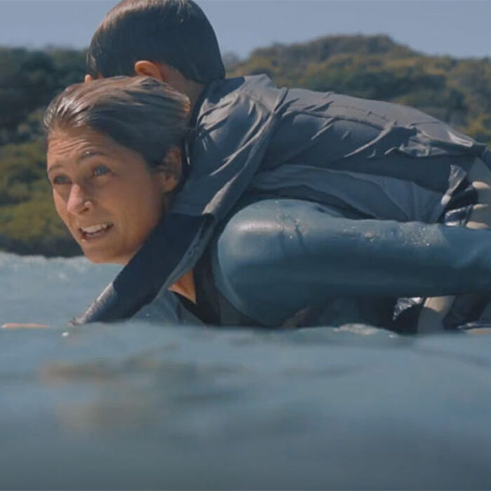 Belinda Baggs balances her son (literally) on her back while juggling a longboard and a fulfilling career. She's THE role model for female surfers.