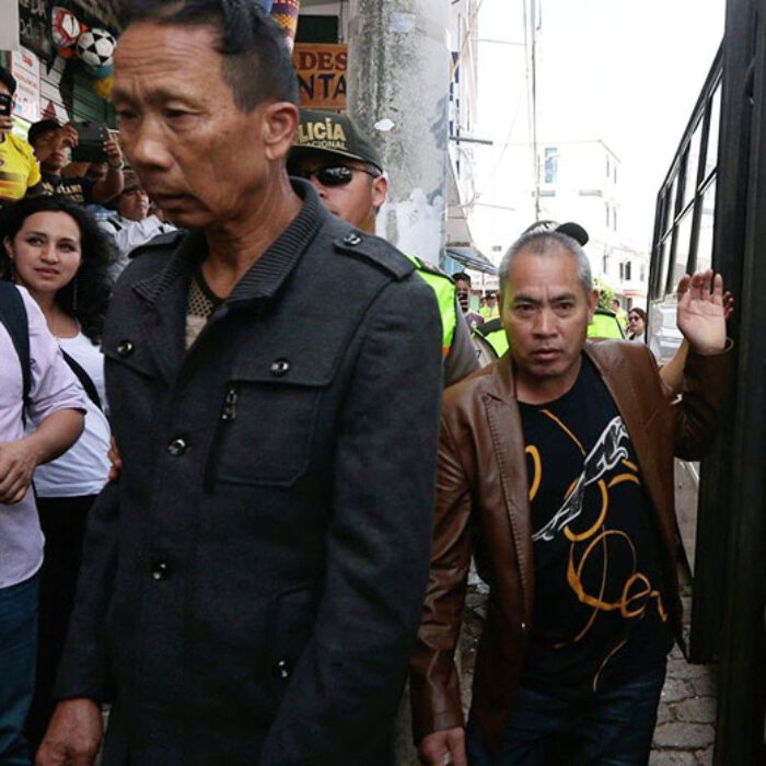 Crew members of the Chinese-flagged ship confiscated by the Ecuadorean Navy arrive in court in San Cristobal, Galapagos Islands on August 25, 2017. Photo: AFP