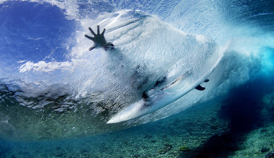 In sharks’ territory. Image: Warm Winds Surf Shop/Flickr, CC BY