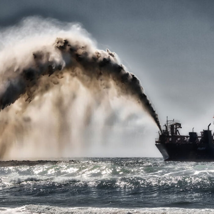 Dredger pumping sand and water to shore for beach renourishment, Mermaid Beach, Gold Coast, Australia, Aug. 20, 2017