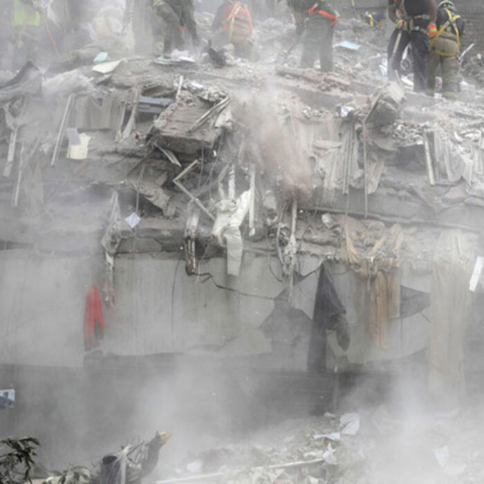 Workers clear debris on Sept. 25, 2017 from the top of a building that collapsed in Mexico City after the Sept. 19 earthquake.
