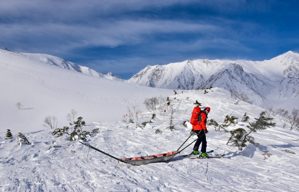 Dave Enright guiding the Freeride World Tour Hakuba rescue team at Happo One