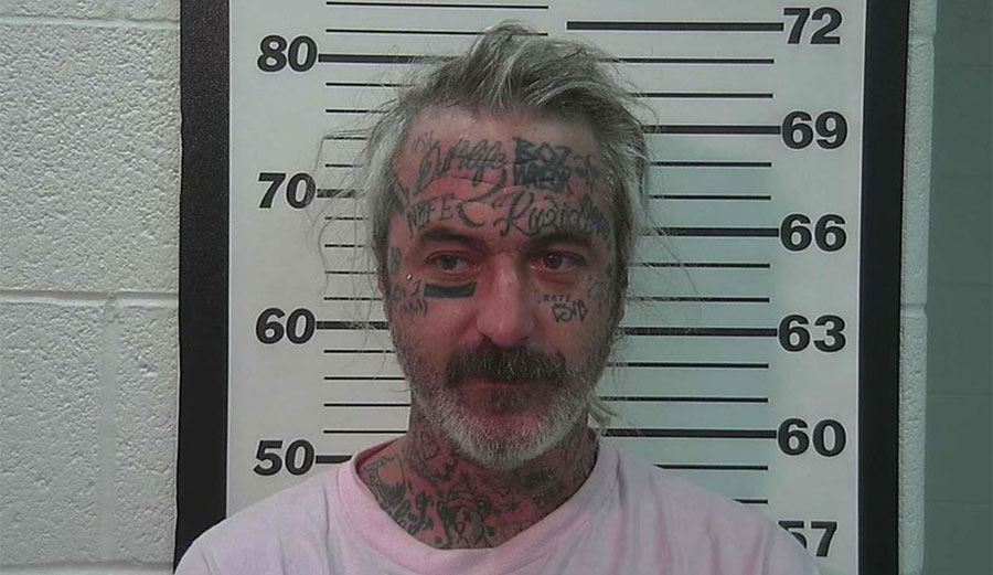 Nate Bozung was arrested on suspicion of holding up a knife to one person and threatening to shoot another person with a rifle. Image: Summit County Jail