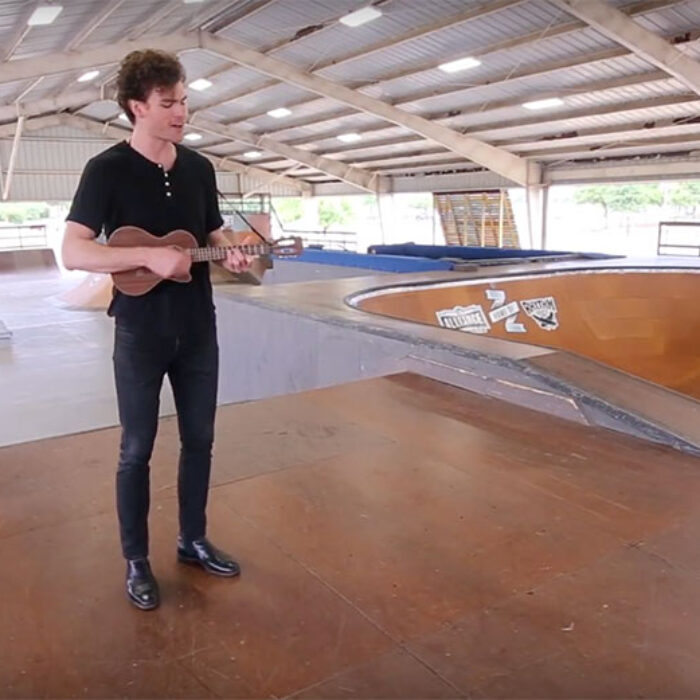 The man can play the ukelele.