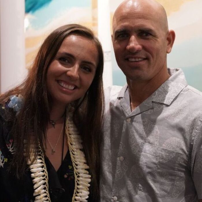 Taylor and Kelly Slater pose for a proud dad moment at Taylor Slater's first solo art show in Montauk. Photo: