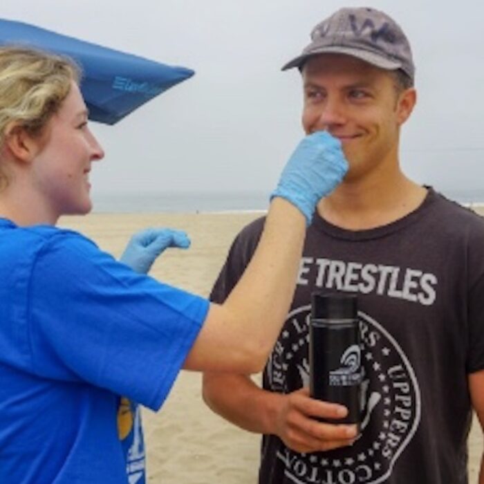 UCLA Ph.D. student Megyn Rugh swabs a surfer's nose to test for the presence of superbugs. Photo: The Surfer Resistance Project