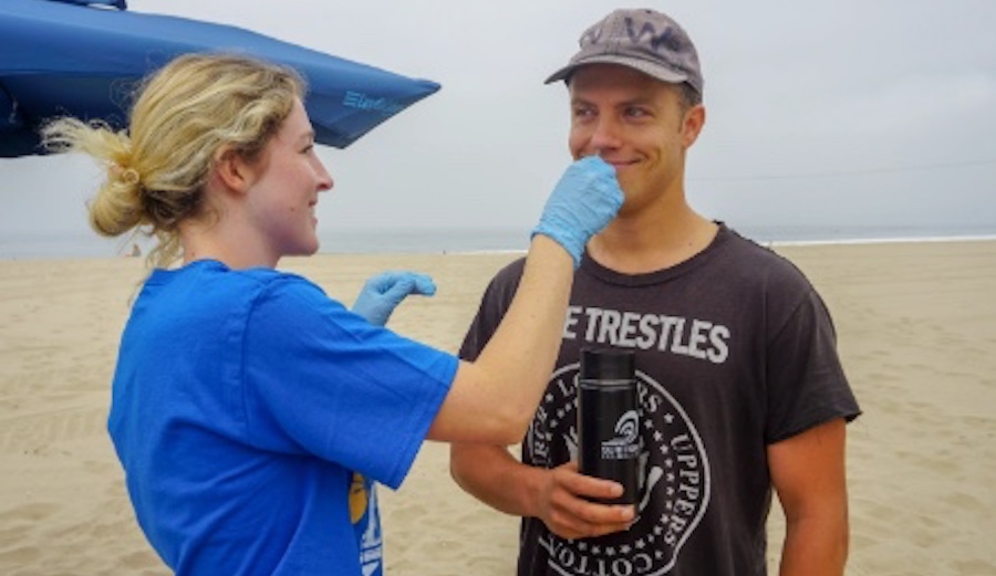 UCLA Ph.D. student Megyn Rugh swabs a surfer's nose to test for the presence of superbugs. Photo: The Surfer Resistance Project