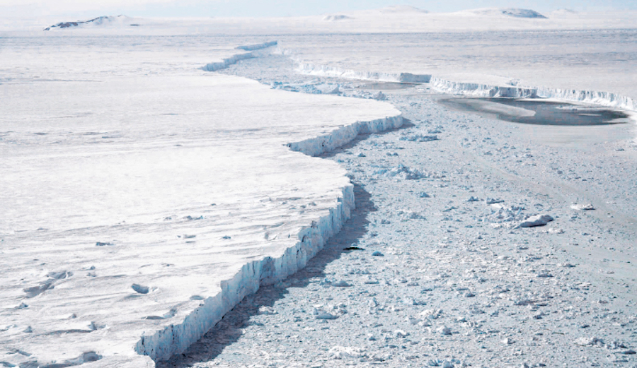 An on the ground photo of the iceberg (left) and the glacier (right) gives a better idea on the scale of the event. Photo: NASA