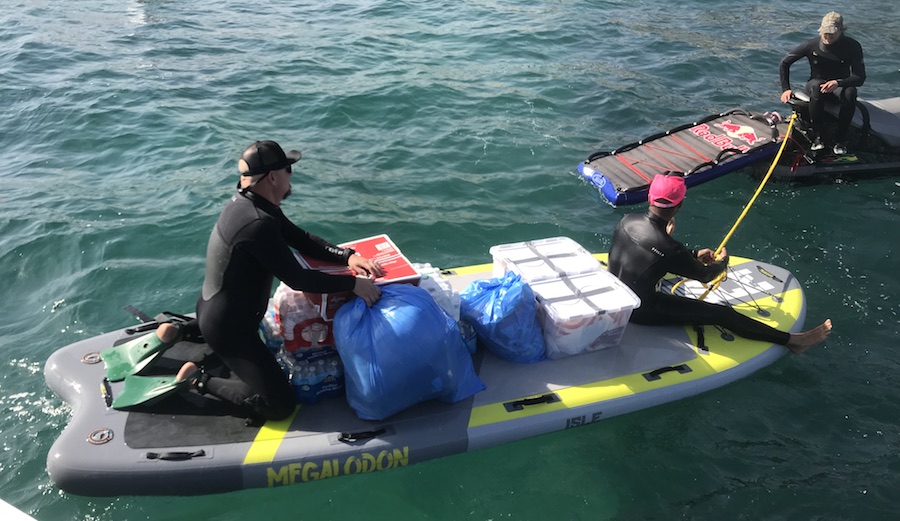 Alex Gray and the crew prep to tow the SUPsquatch to shore. Photo: Harris