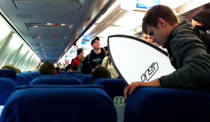 Photoshopped traveler with surfboard