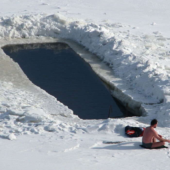 Man swimming in cold water