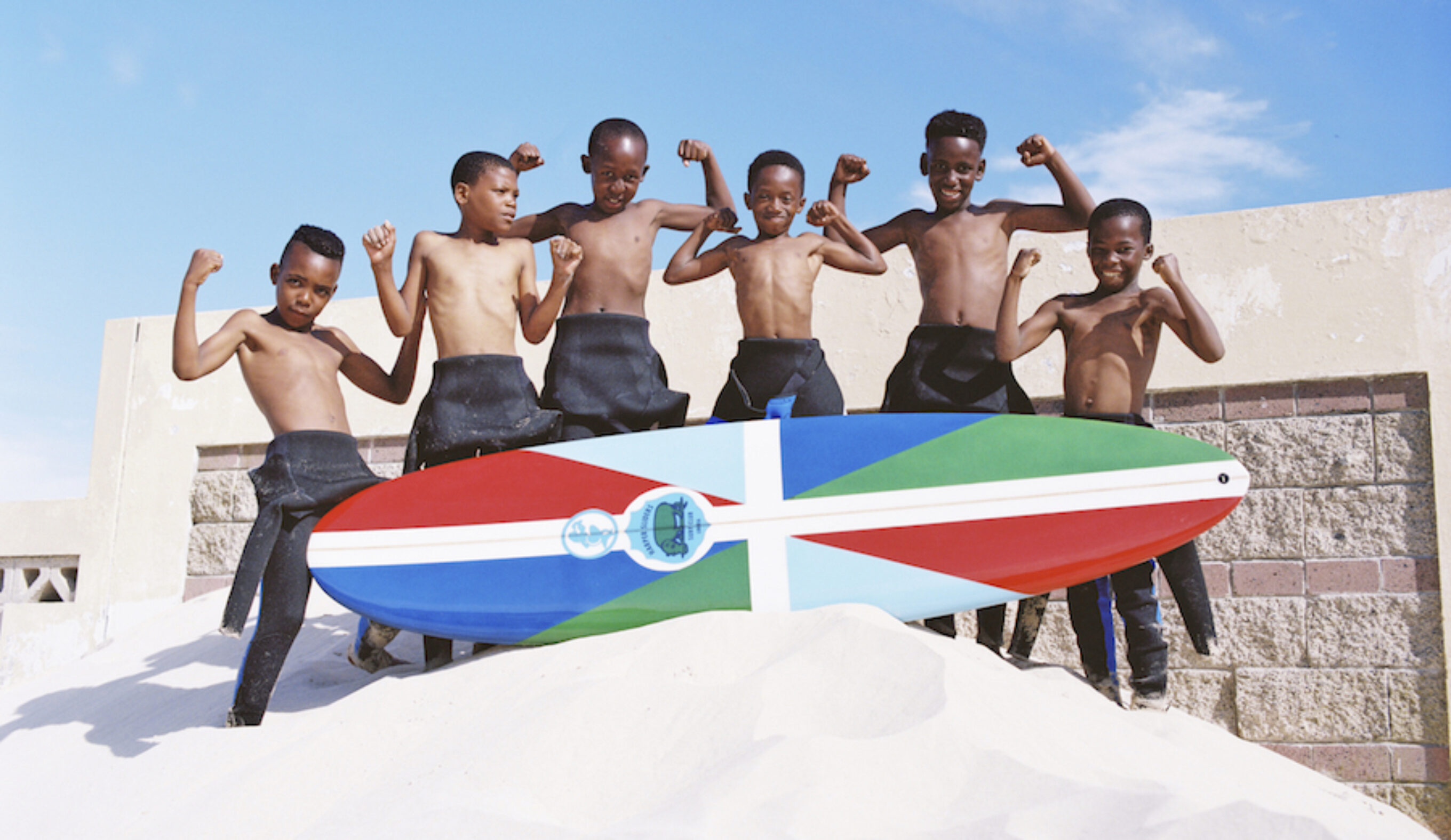 The kids of Harper, Liberia may be new to surfing but it's giving them a new lease on life. Photo: Mami Wata