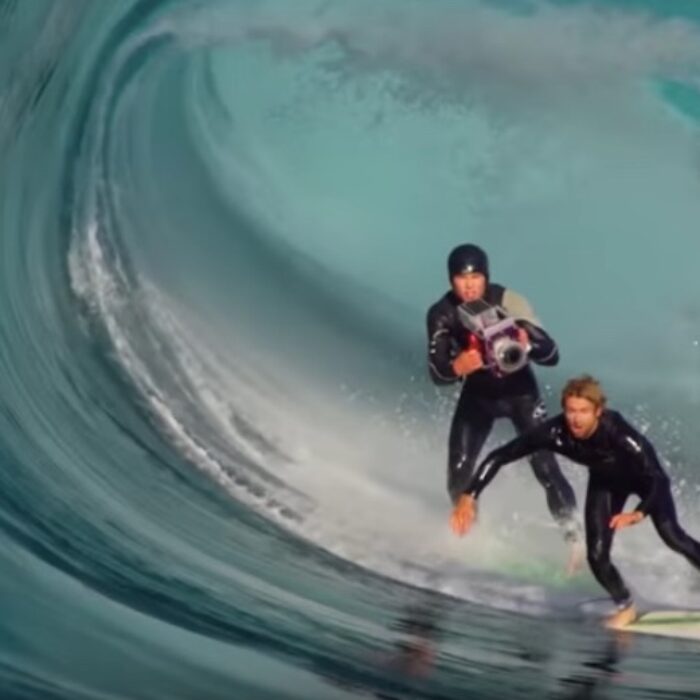 Leroy Bellet chases a surfer with a $100,000 camera that's about to take a beating.