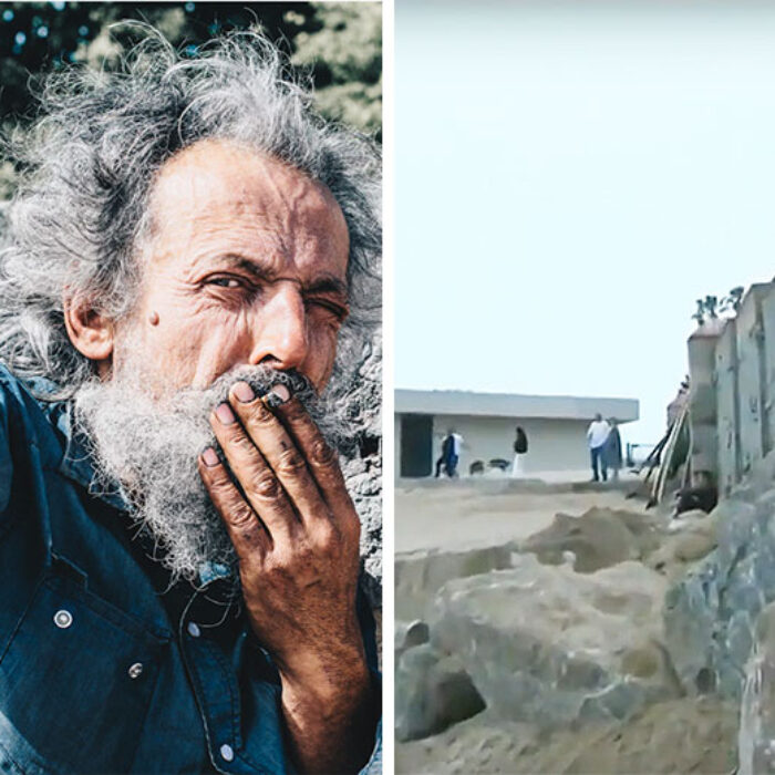 Man in front of Malibu wall