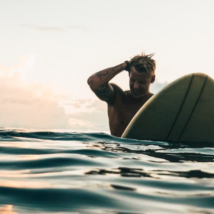 Surfer scratching head.