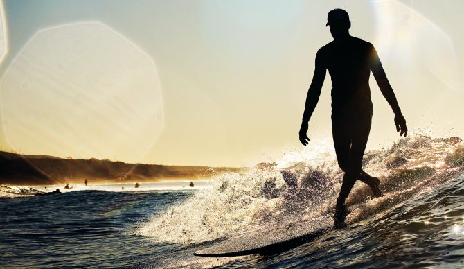 Longboard surfer in California