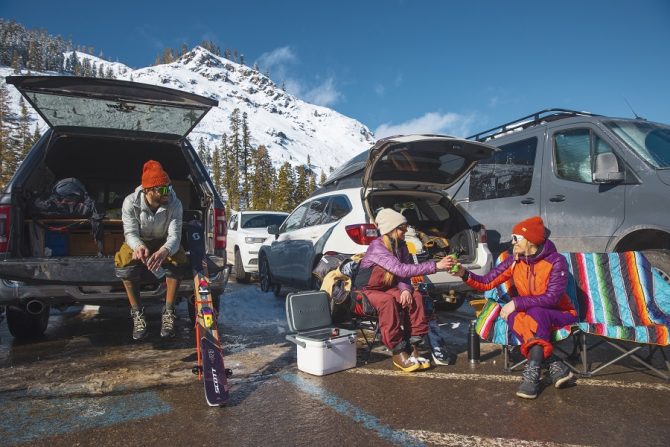 McKenna Peterson, Sam Cohen, Amie Engerbretson  enjoying some apre ski beers in the parking lot of Alpine Meadows. Photo: IKON Pass. 