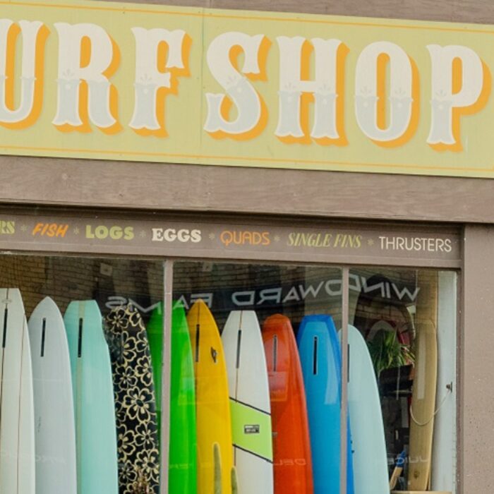 surf shop with surfboards in the window
