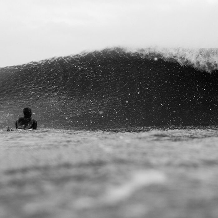 man about to duck-dive under a wave in Rhode Island