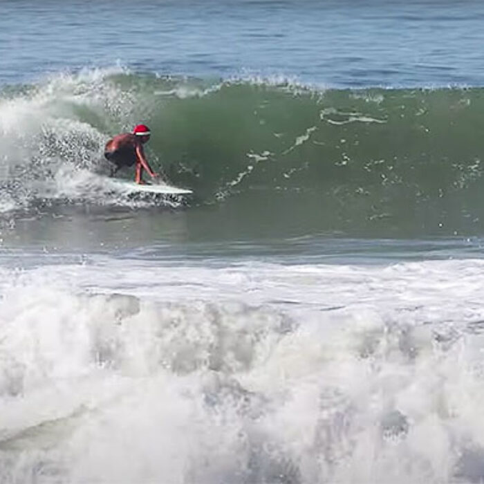 Surfer in a santa hat at Canggu