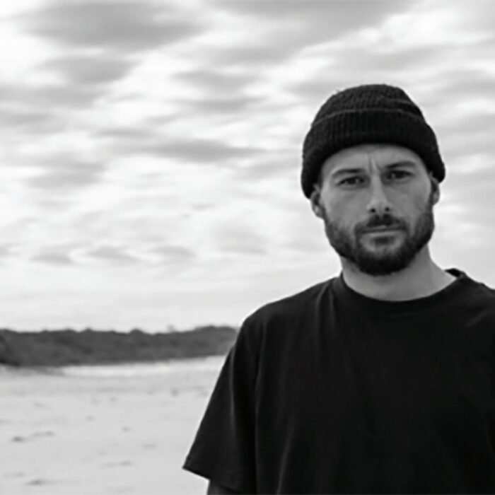 Dion Agius in front of the ocean