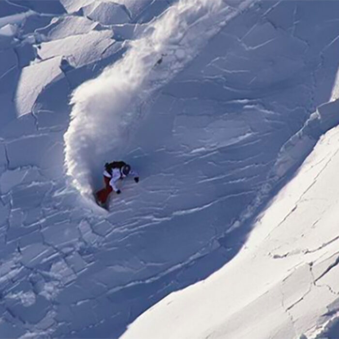 Mat Schaer escaping an avalanche on his snowboard in the Alps