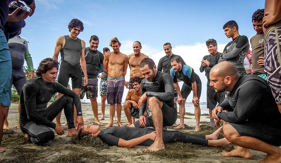 Big wave surfers practicing on land