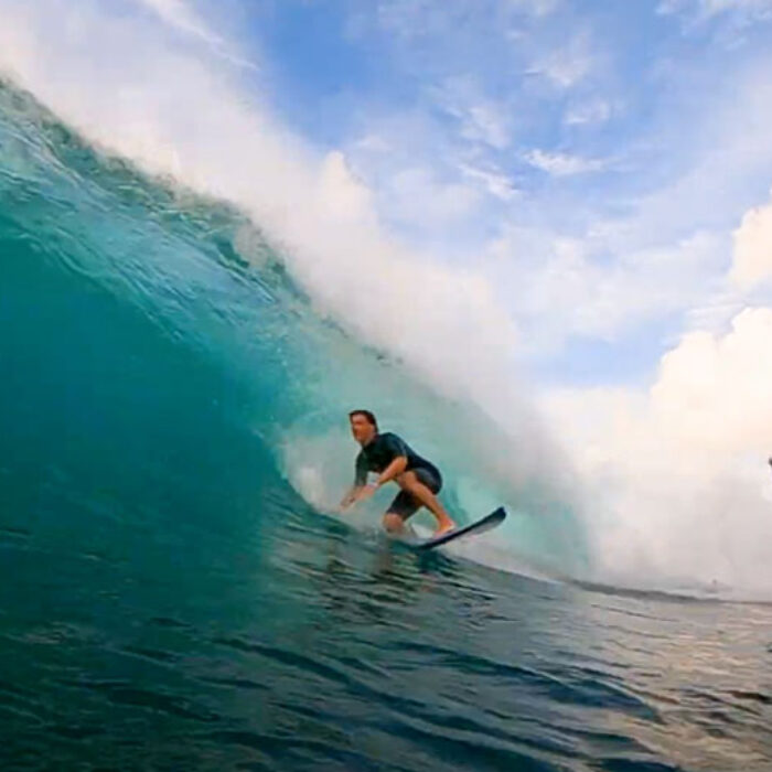 Jackson Lebsack getting barreled on a surfboard