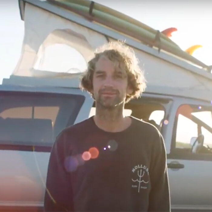 Jay Nelson stands in front of a pop top that he built
