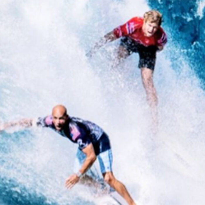 Kelly Slater and John John Florence surfing at Pipe Masters