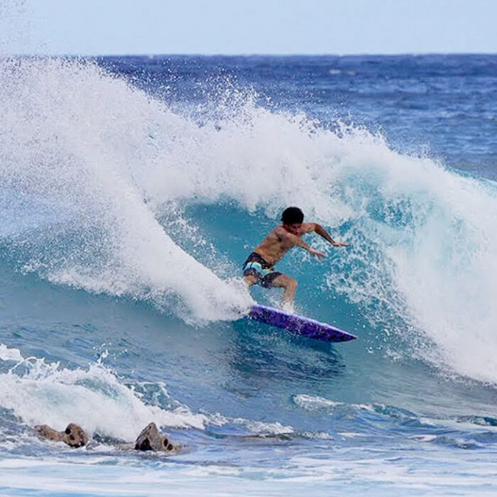 Mason Ho surfing on Oahu