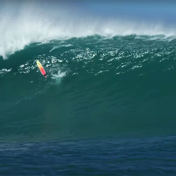 Koa Smith's surfboard going over a huge wave at Phantoms