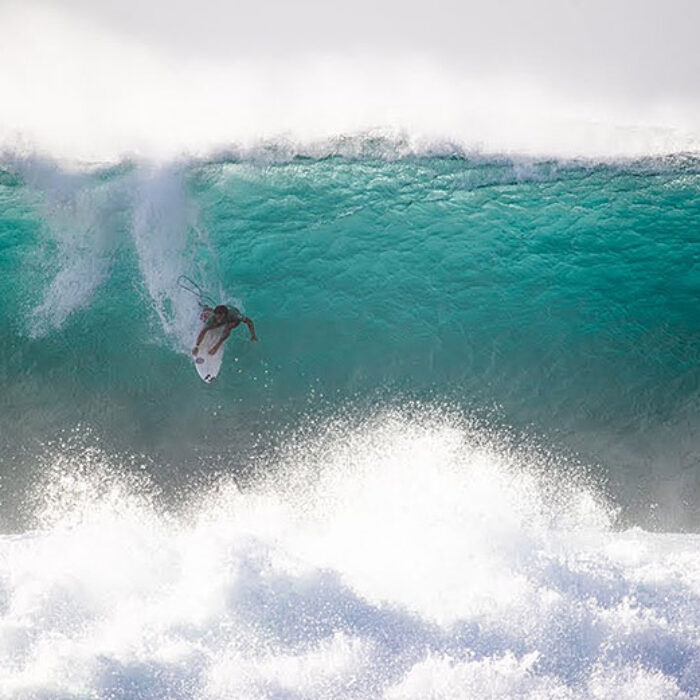 Surfing dropping in at Pipeline, North Shore Oahu