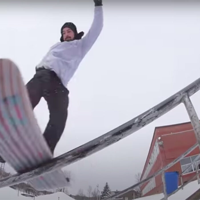 Dave Engerer on a snowskate riding a rail