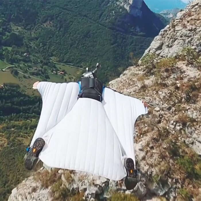 Footage of wingsuit BASE jumper captured by drone
