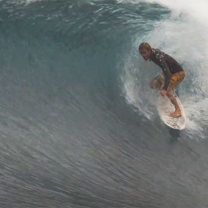 Gavin Beschen surfing in the barrel on Oahu North Shore