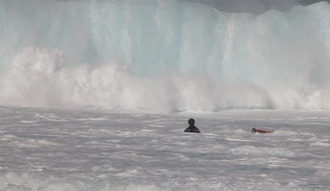 Mark Healey ditches his board in front of a big wave