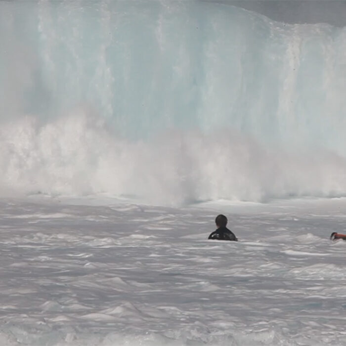 Mark Healey ditches his board in front of a big wave