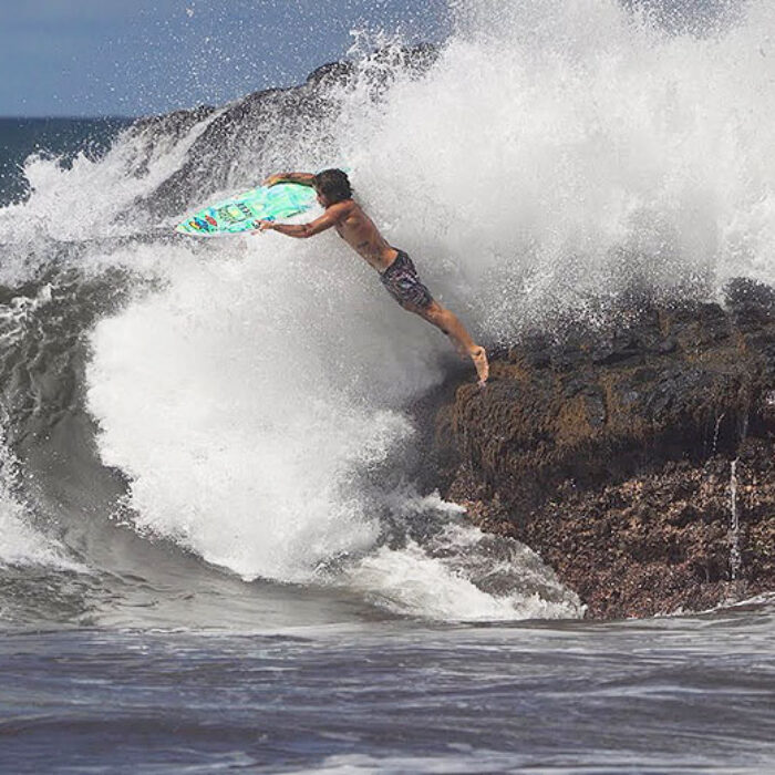 Mason Ho surfing in Hawaii